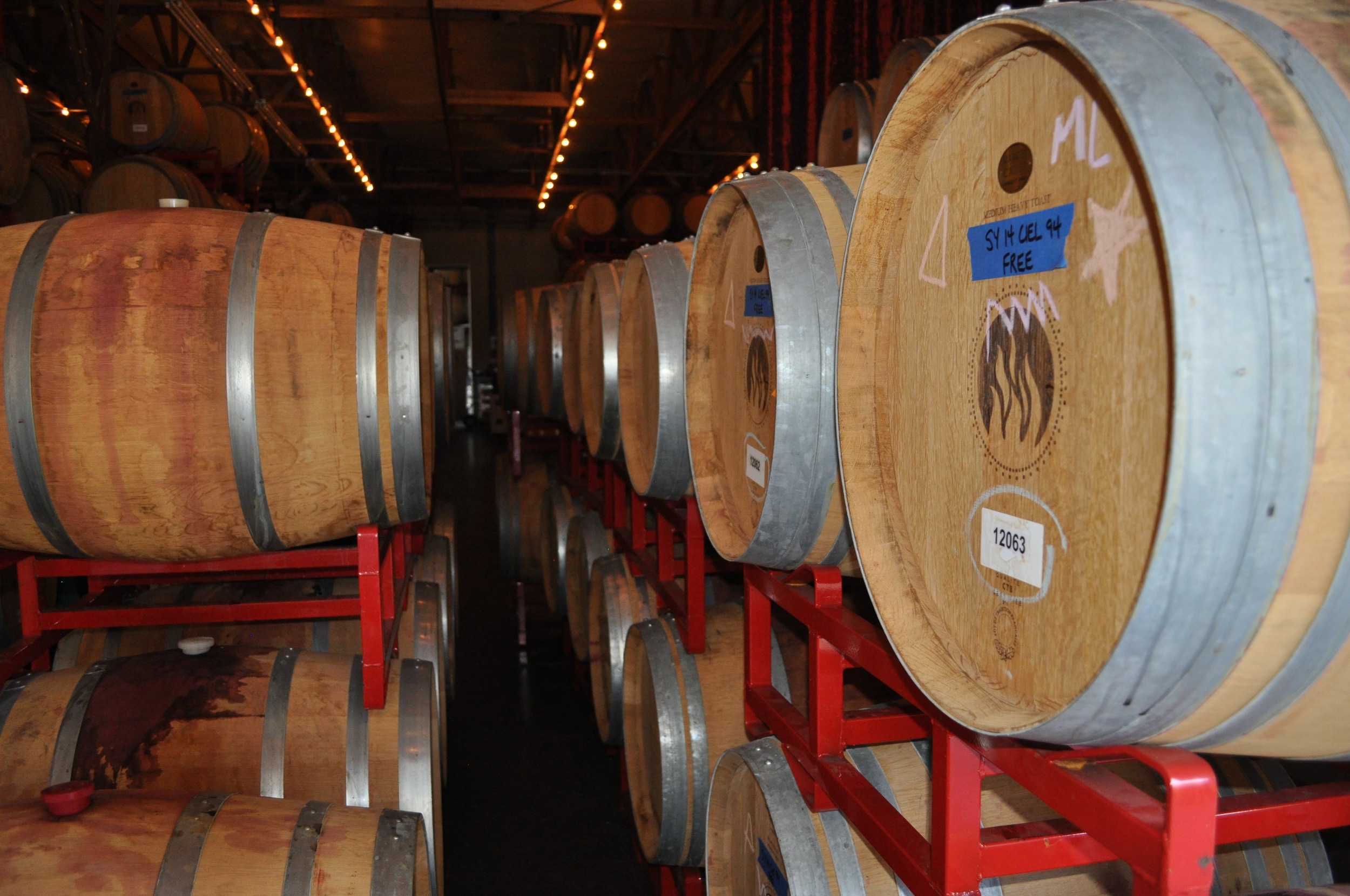 Aging wine in barrels.